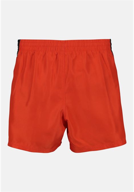 Shorts mare bambino nero e rosso bande laterali logate NIKE | NESSD794614