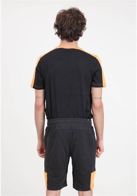 Shorts da uomo neri e arancioni Ess block x tape PUMA | Shorts | 67334456