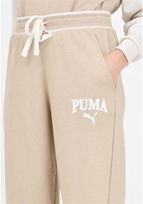 Pantaloni sportivi da donna Puma SQUAD Pants TR beige PUMA | Pantaloni | 67790183