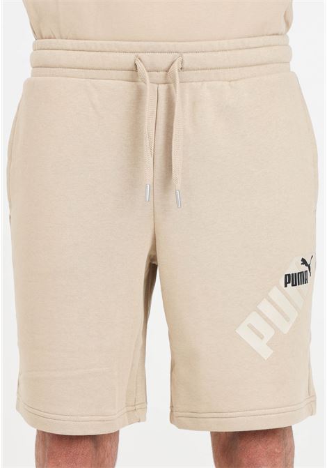 Shorts da uomo beige Puma power graphic PUMA | 67896583