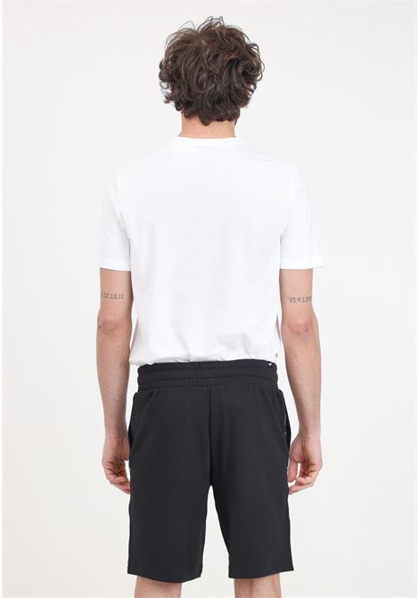 Essentials+ Tape men's black shorts PUMA | Shorts | 84738701