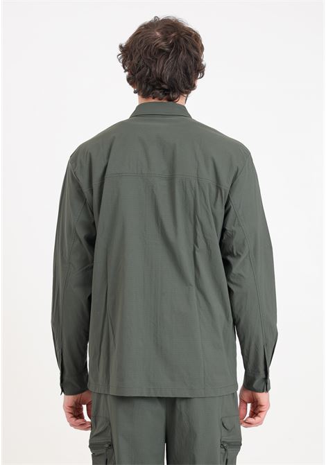 Green men's windbreaker with large zipped pockets on the front RAINS | RA19320GRE