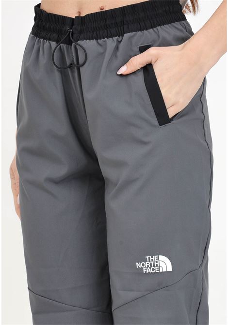 Pantaloni da donna antivento grigio antracite e neri THE NORTH FACE | Pantaloni | NF0A87G5WUO1WUO1