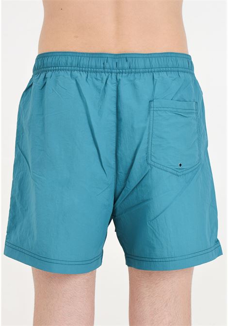 Shorts mare ottanio da uomo con ricamo patch logo TOMMY HILFIGER | Beachwear | UM0UM03147CT0