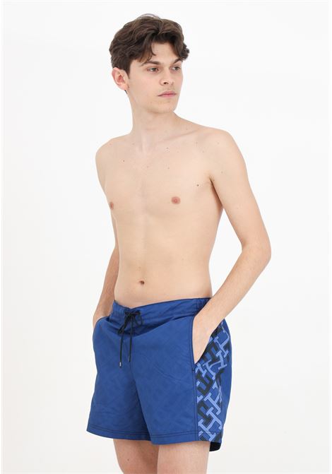Blue men's swim shorts with TH monogram print TOMMY HILFIGER | Beachwear | UM0UM032110G3