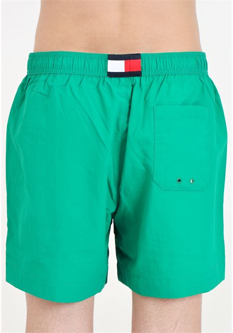 Green men's swim shorts with small logo TOMMY HILFIGER | Beachwear | UM0UM03280L4B