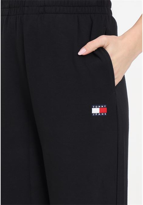 Pantaloni tuta da donna neri con logo TOMMY JEANS | DW0DW17312BDSBDS