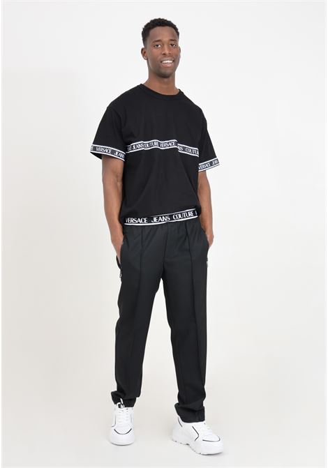 Pantaloni neri con banda elastica logata VERSACE JEANS COUTURE | Pantaloni | 76GAA109N0309899