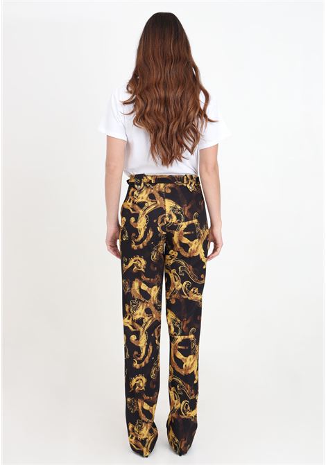 Black women's trousers with black and gold couture watercolor print VERSACE JEANS COUTURE | 76HAA111NS403G89